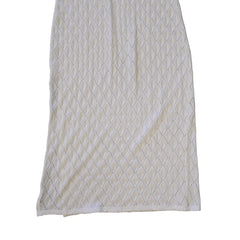 White textured dress on a light background.