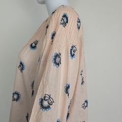 Floral-patterned flowy top on a light background