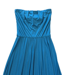 Blue strapless dress on a tiled floor