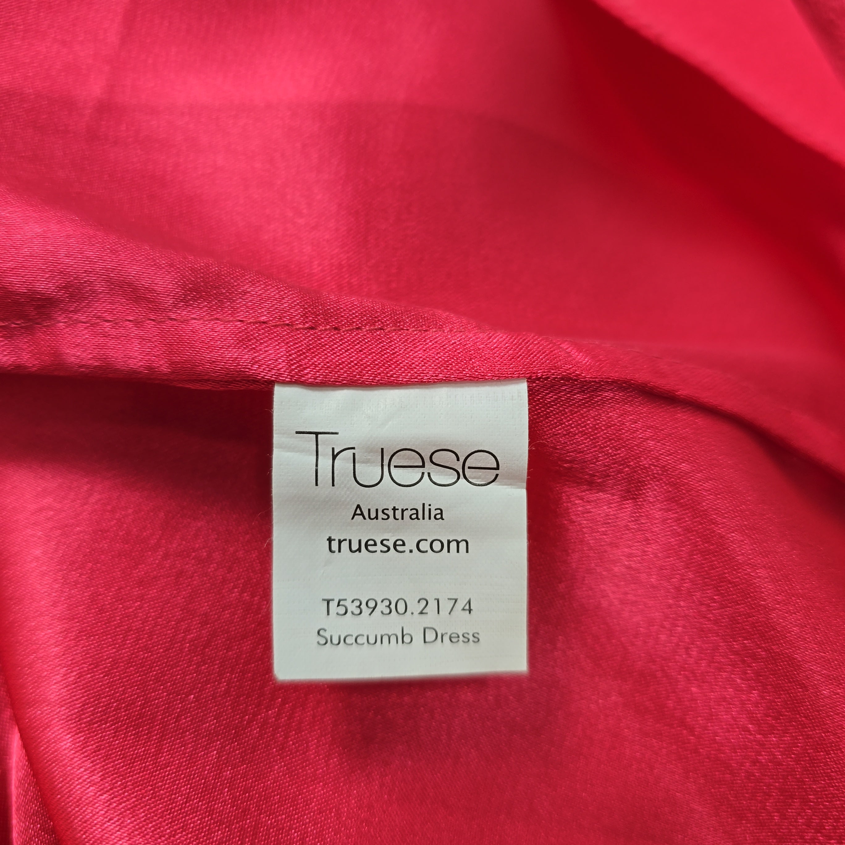 Truese label on a red fabric background
