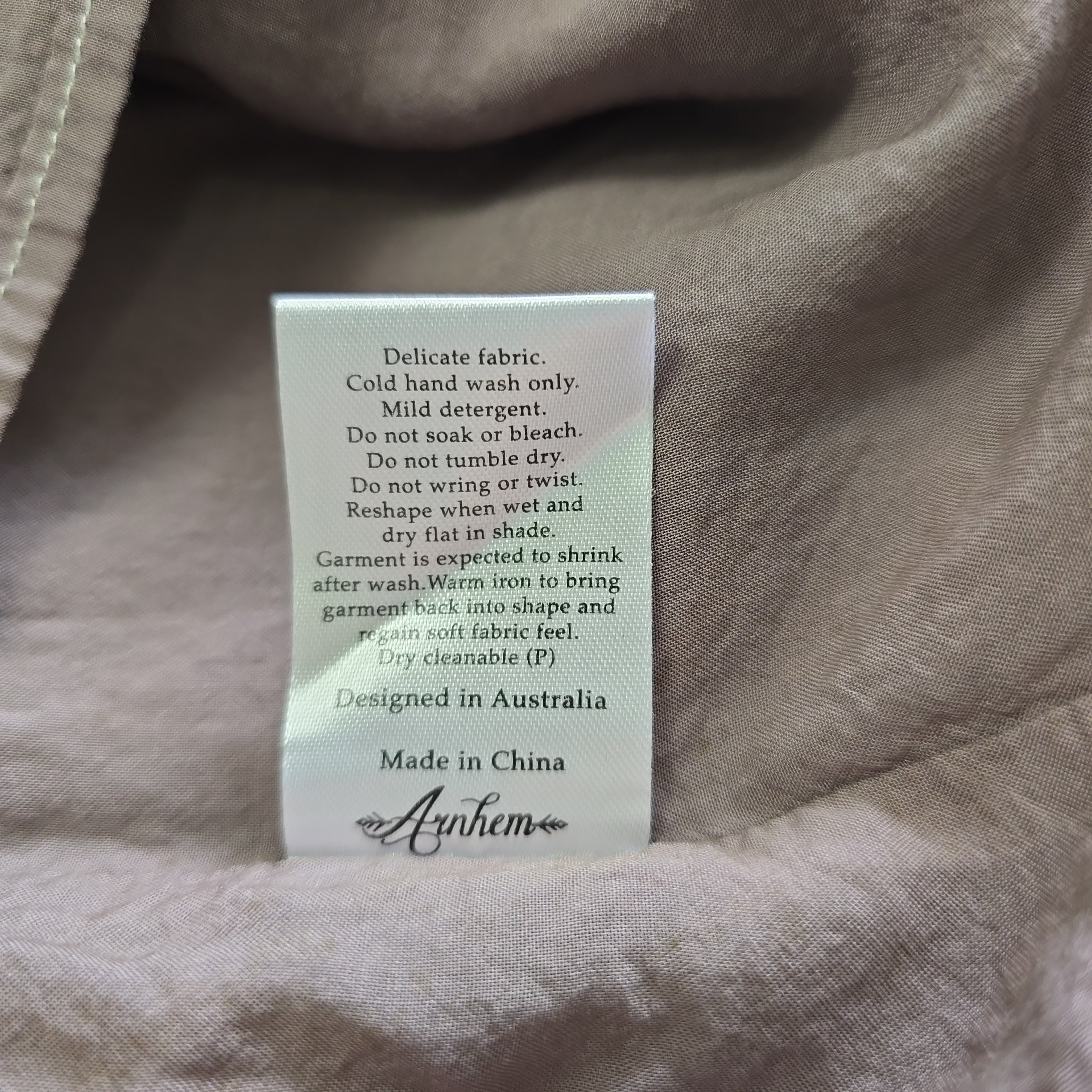 Fabric tag on a brown fabric background