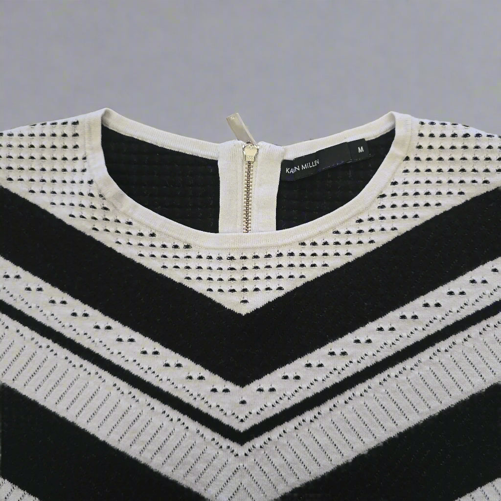 Black and white patterned tank top on a tiled floor