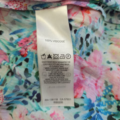 Floral fabric with a visible label on a multicolored background