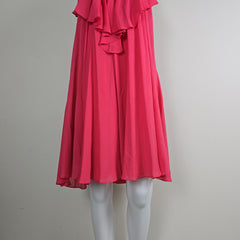 Red dress on a mannequin against a plain background