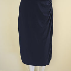 Folded navy blue fabric on a beige background