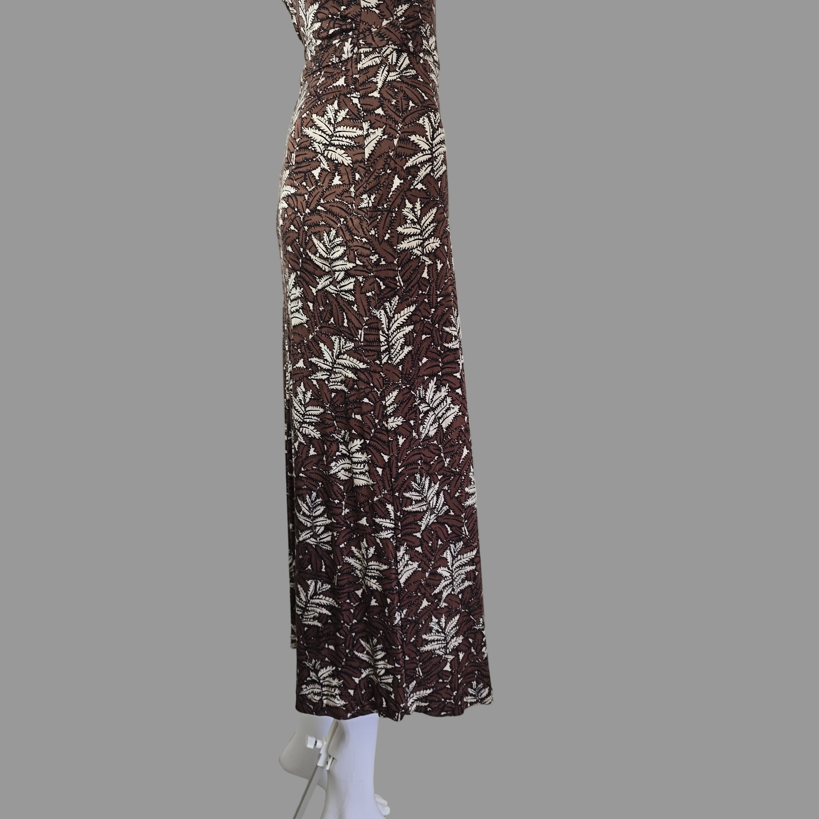 Brown and white patterned dress on a white cabinet