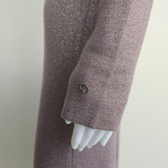 Close-up of a textured purple sleeve with a CD logo on a light gray background