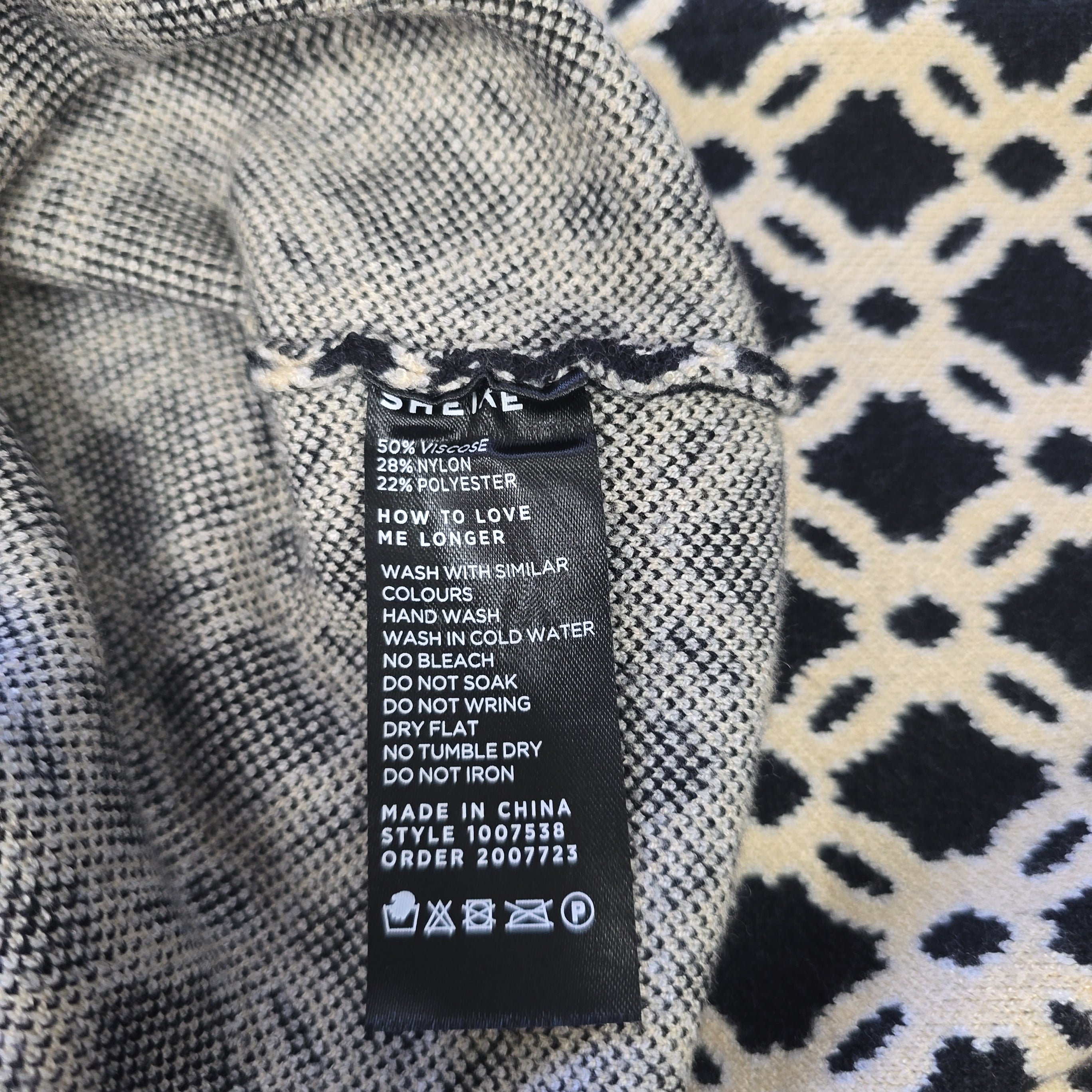 Clothing label on a textured fabric background