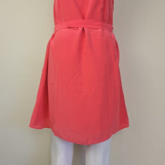 Pink dress on a mannequin against a beige background