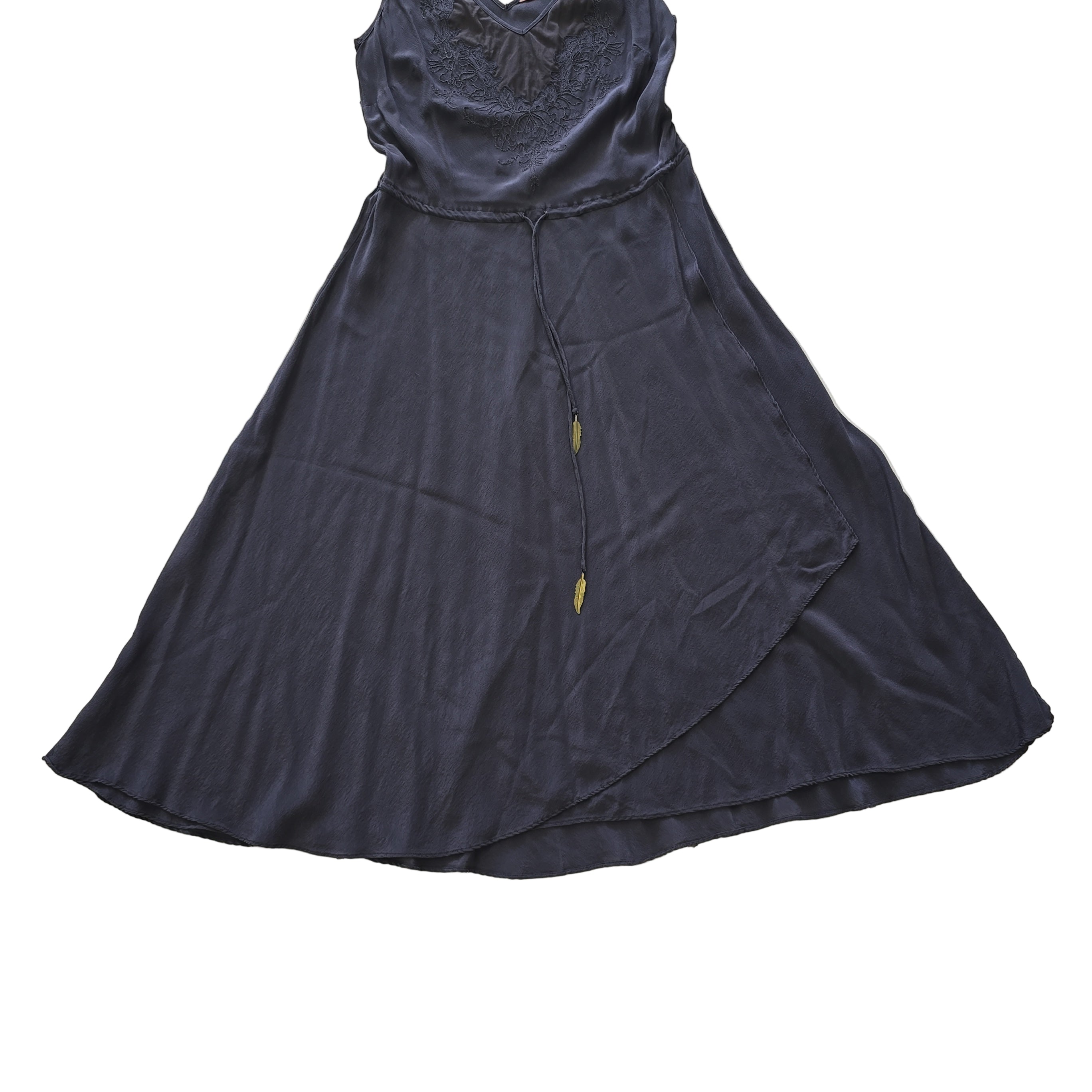 Dark grey dress on a tiled floor