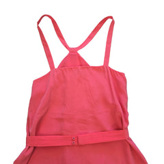 Pink dress with thin straps on a light background