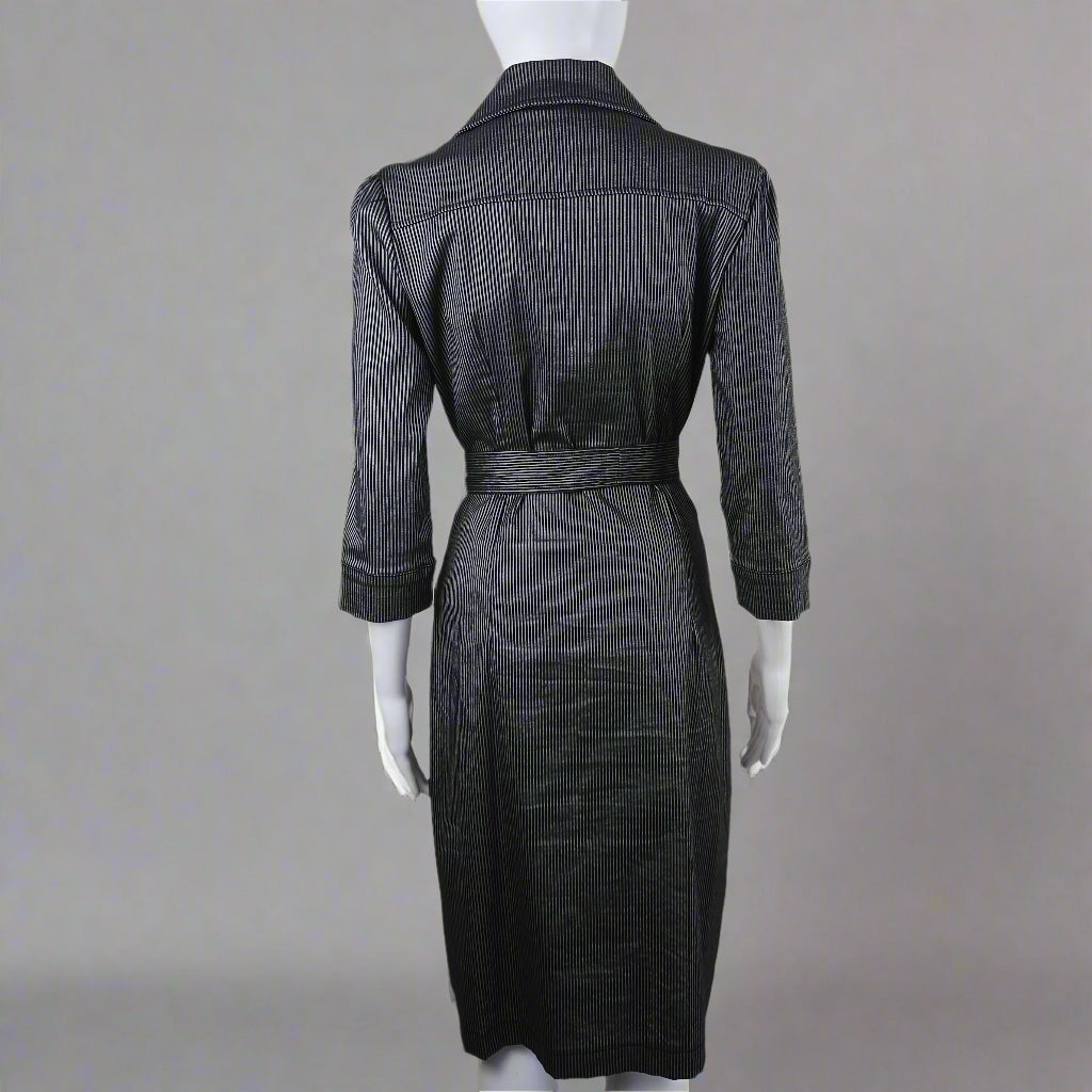 Black pinstripe suit on a mannequin against a plain background