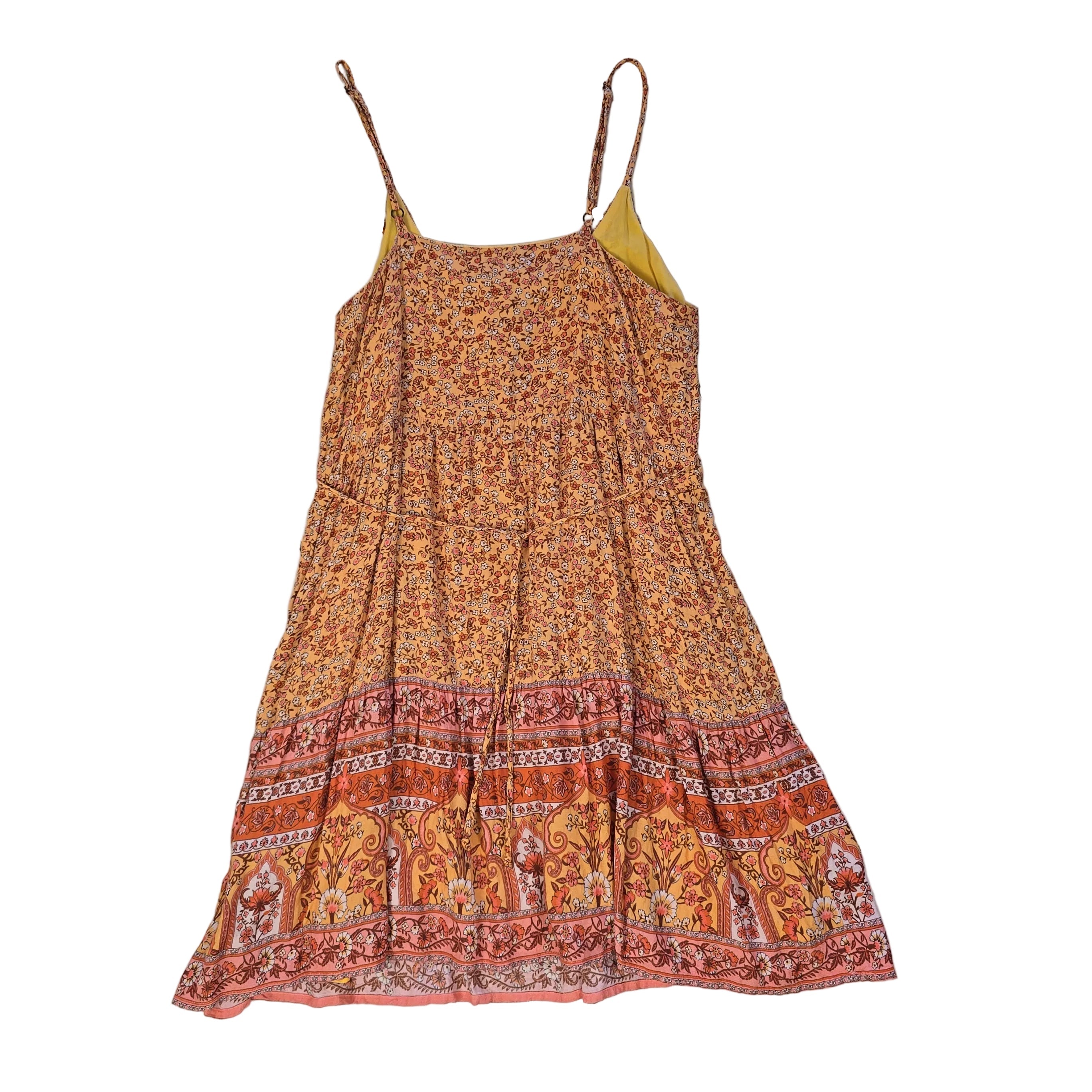 Orange patterned dress on a light background