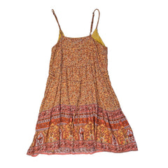 Orange patterned dress on a light background