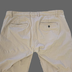 Beige pantss on a tiled floor