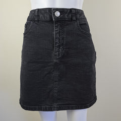 Black denim skirt on a white background