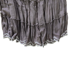 Grey ruffled skirt on a light background