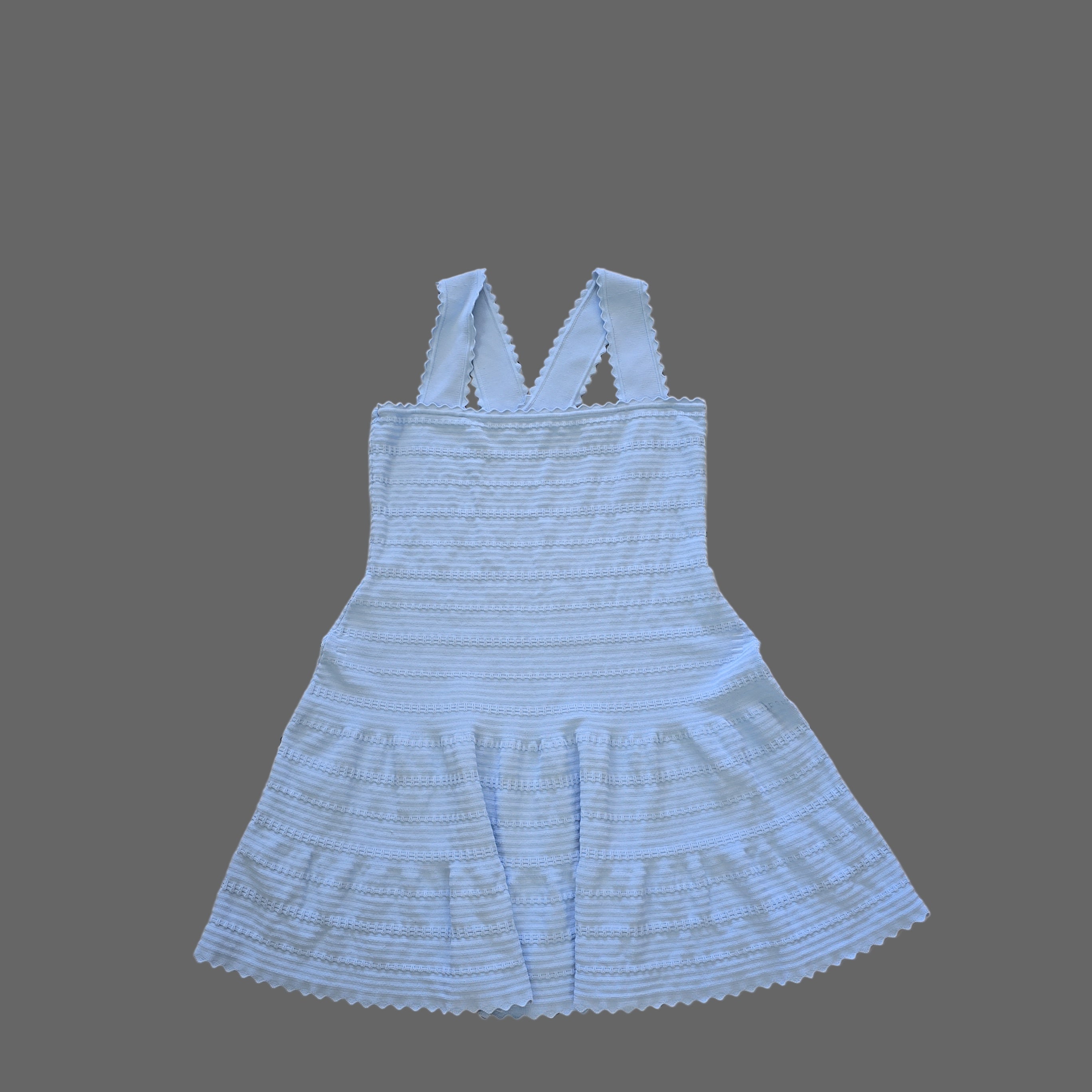 Light blue dress on a tiled floor