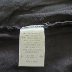 Clothing label on a dark fabric background