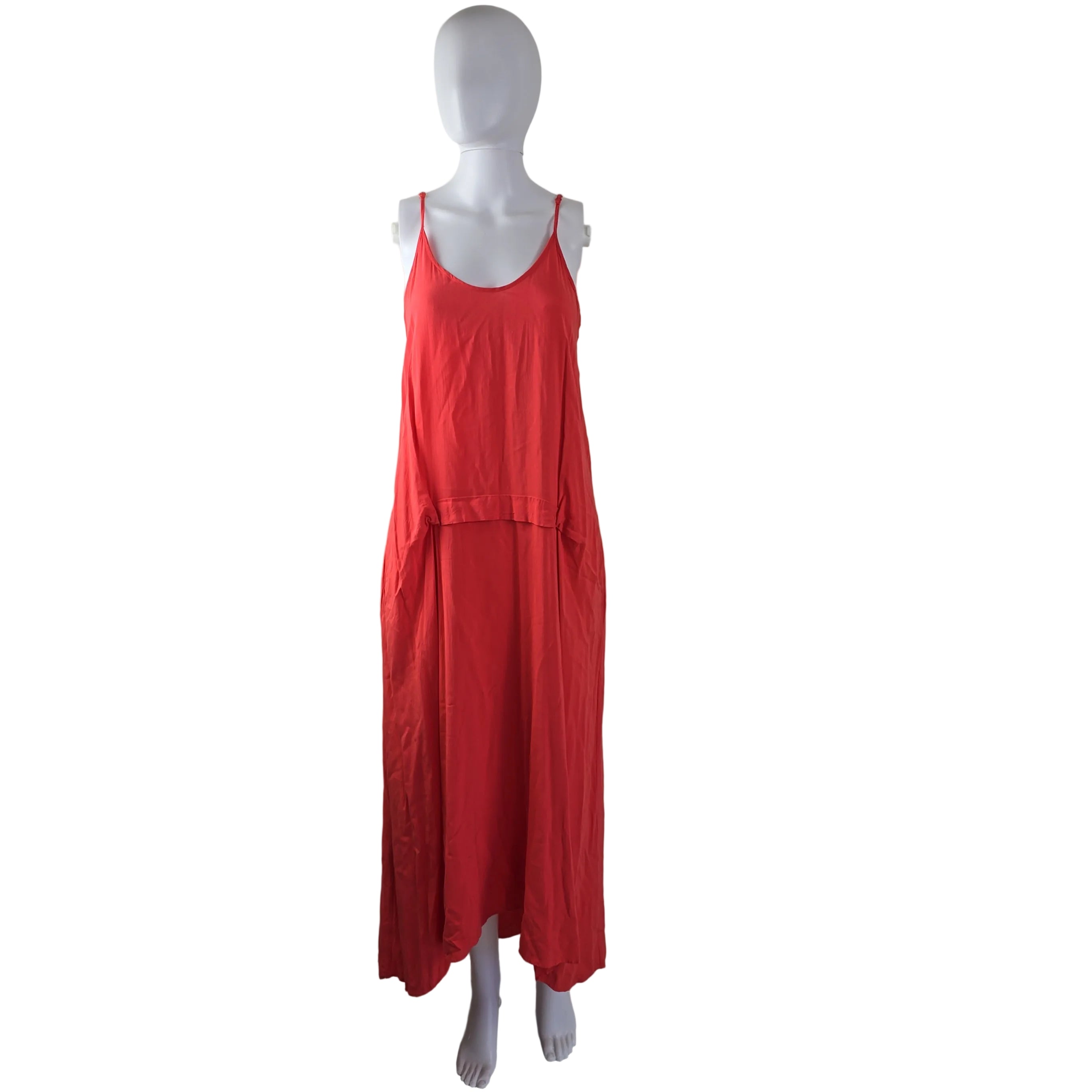 Red dress on a mannequin against a white wall