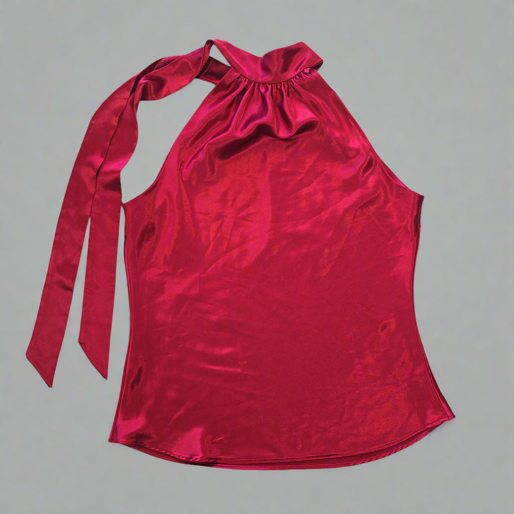 Red top with bow details on a tiled floor