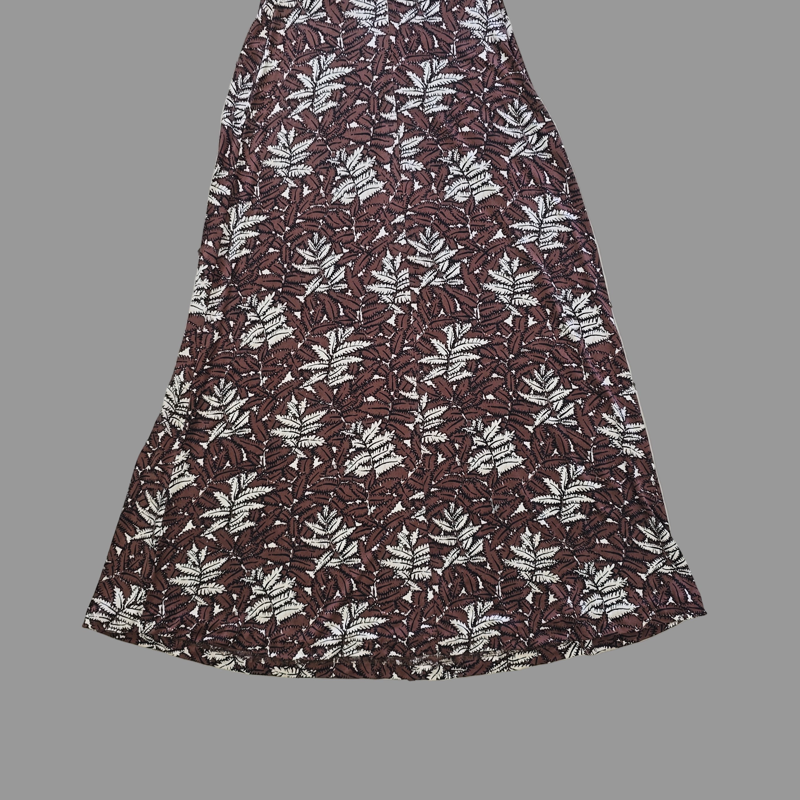 Fabric with leaf pattern on a tiled floor