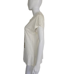 Mannequin wearing a white top with a blurred background