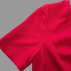 Close-up of a red fabric with a plain background