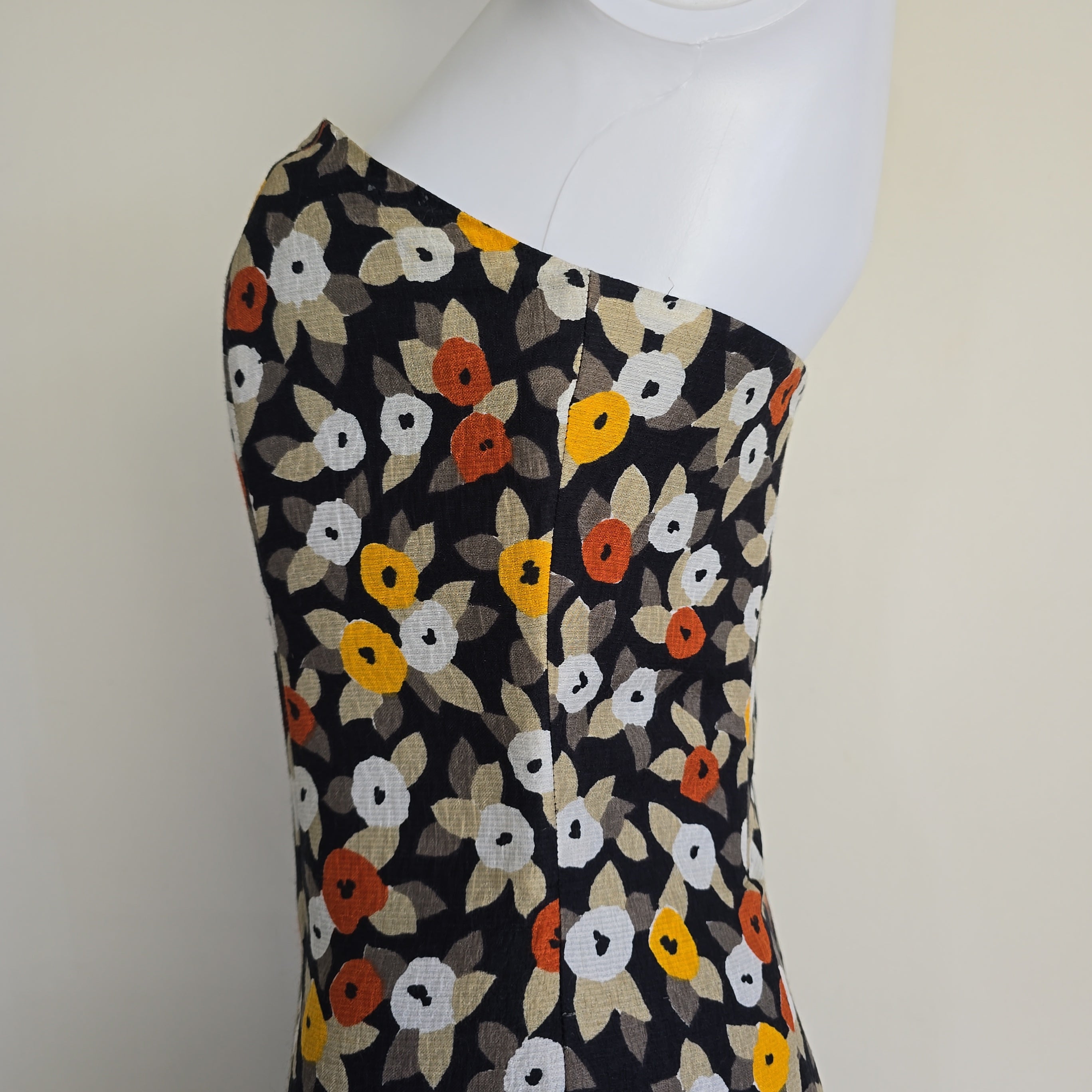 Floral-patterned strapless dress on a light background