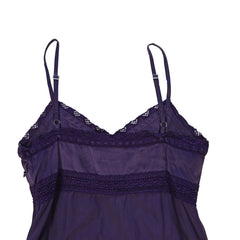 Purple lace-trimmed top on a light background
