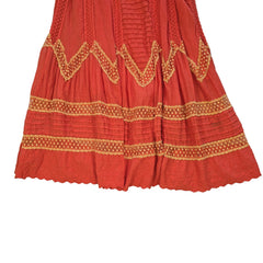 Orange dress with yellow embroidery on a light background