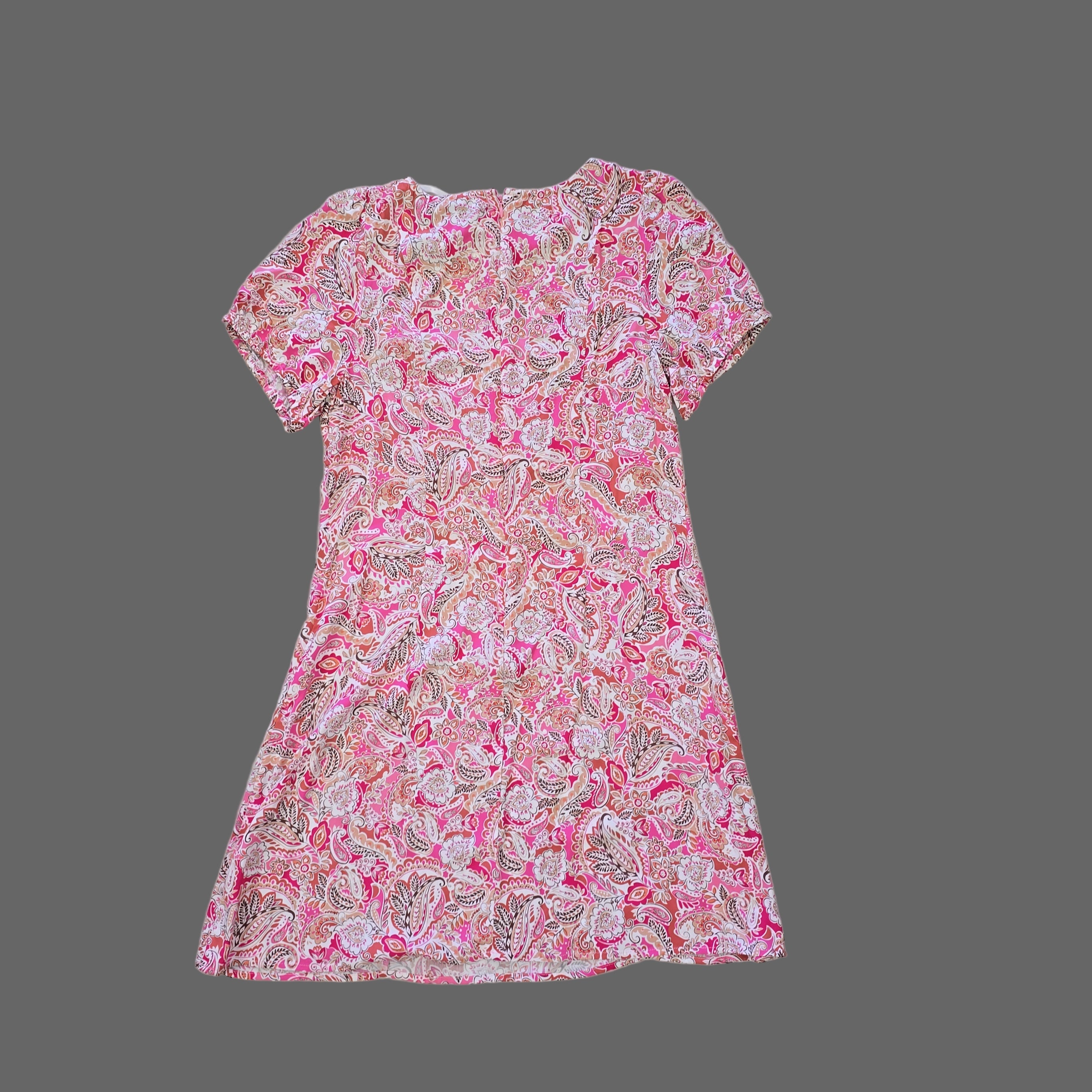 Pink floral dress on a tiled floor