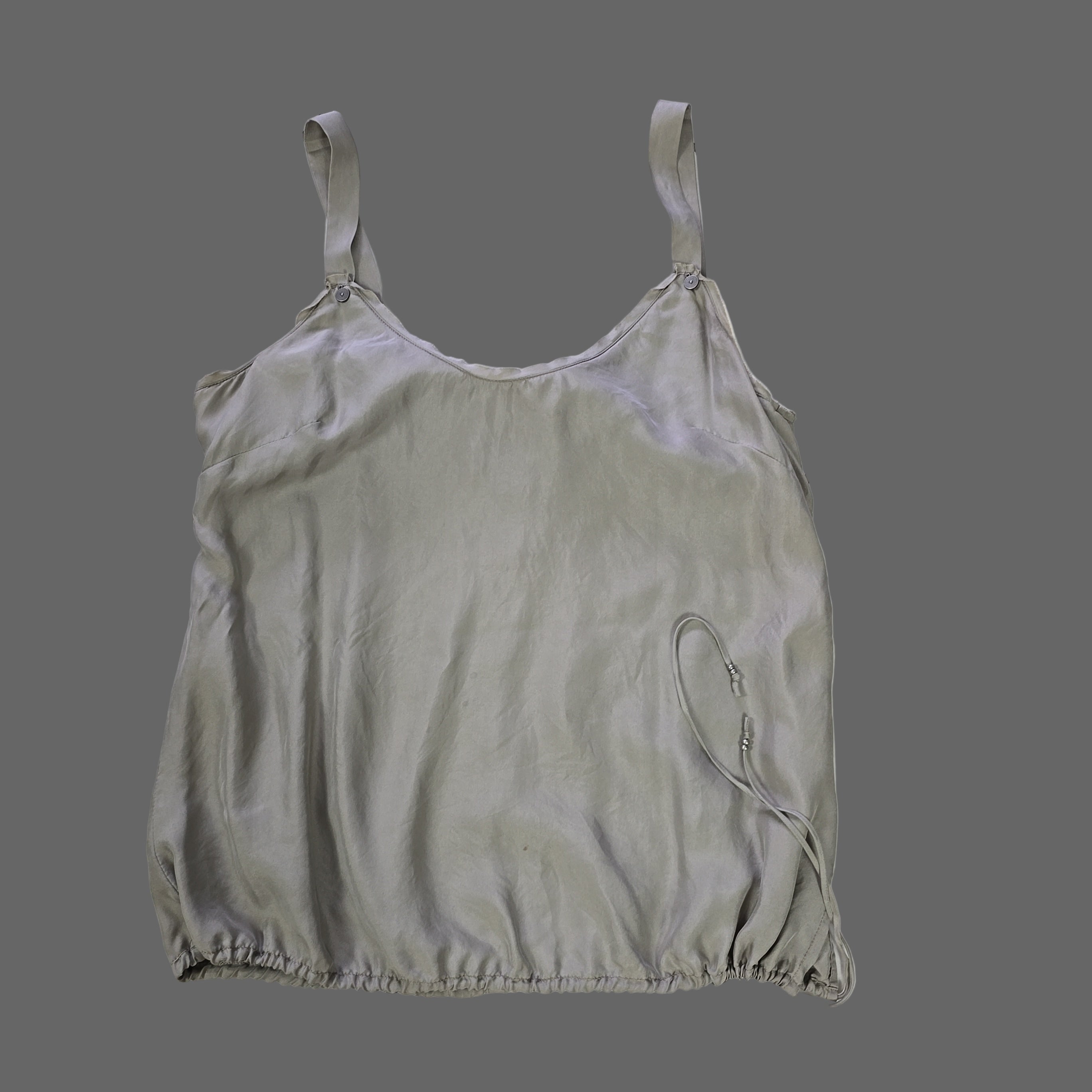 Light gray satin top on a tiled floor