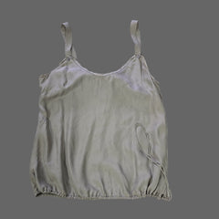 Light gray satin top on a tiled floor