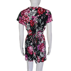 Floral-patterned mini dress on a light background
