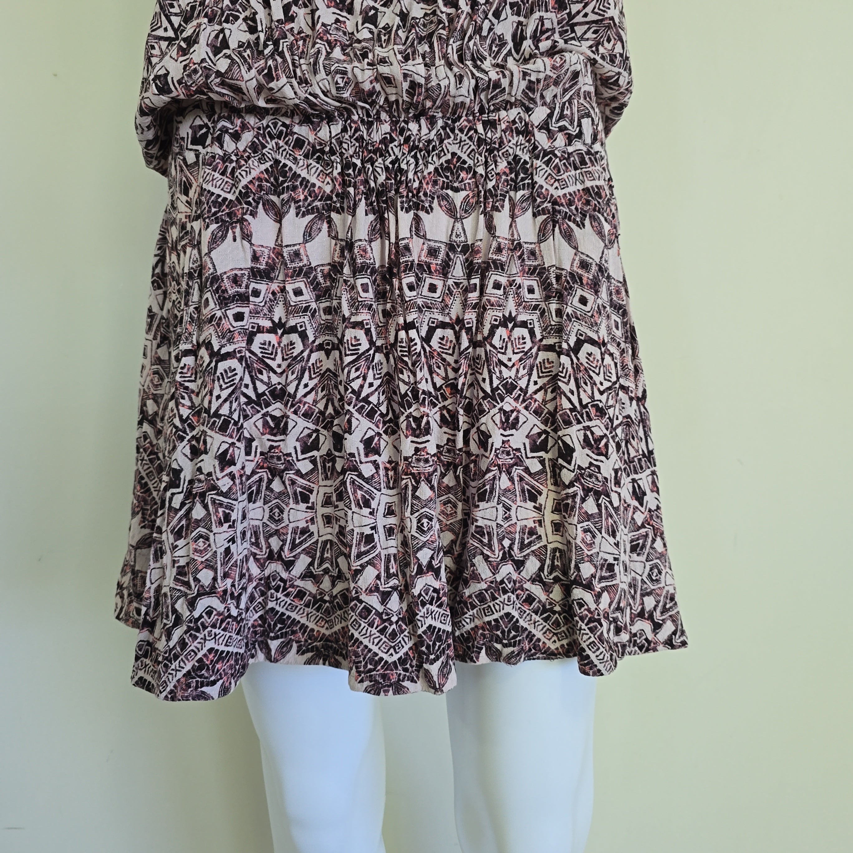 Patterned skirt on a mannequin against a light background