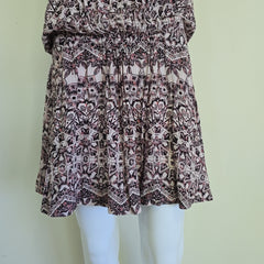 Patterned skirt on a mannequin against a light background