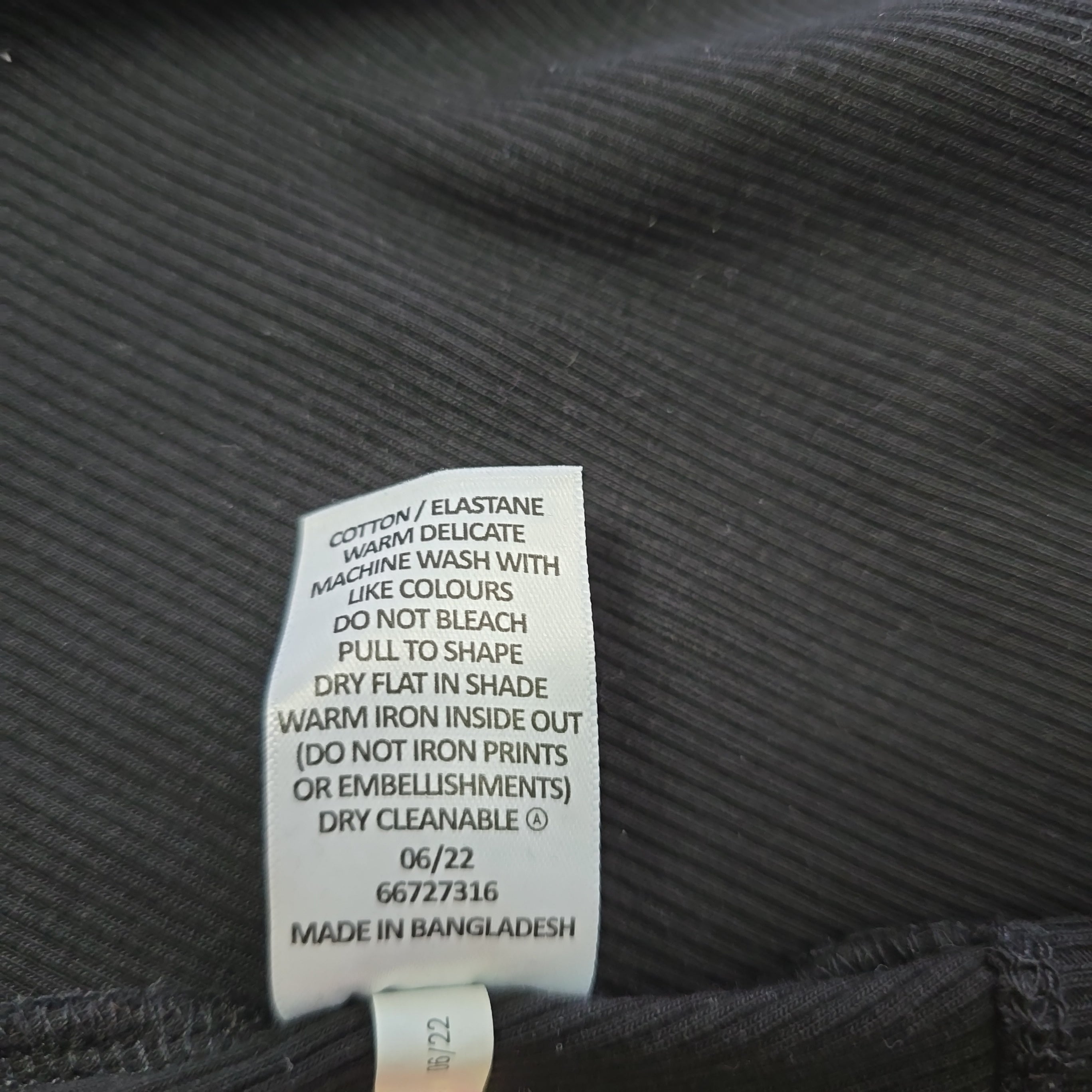 Clothing label on a textured fabric background