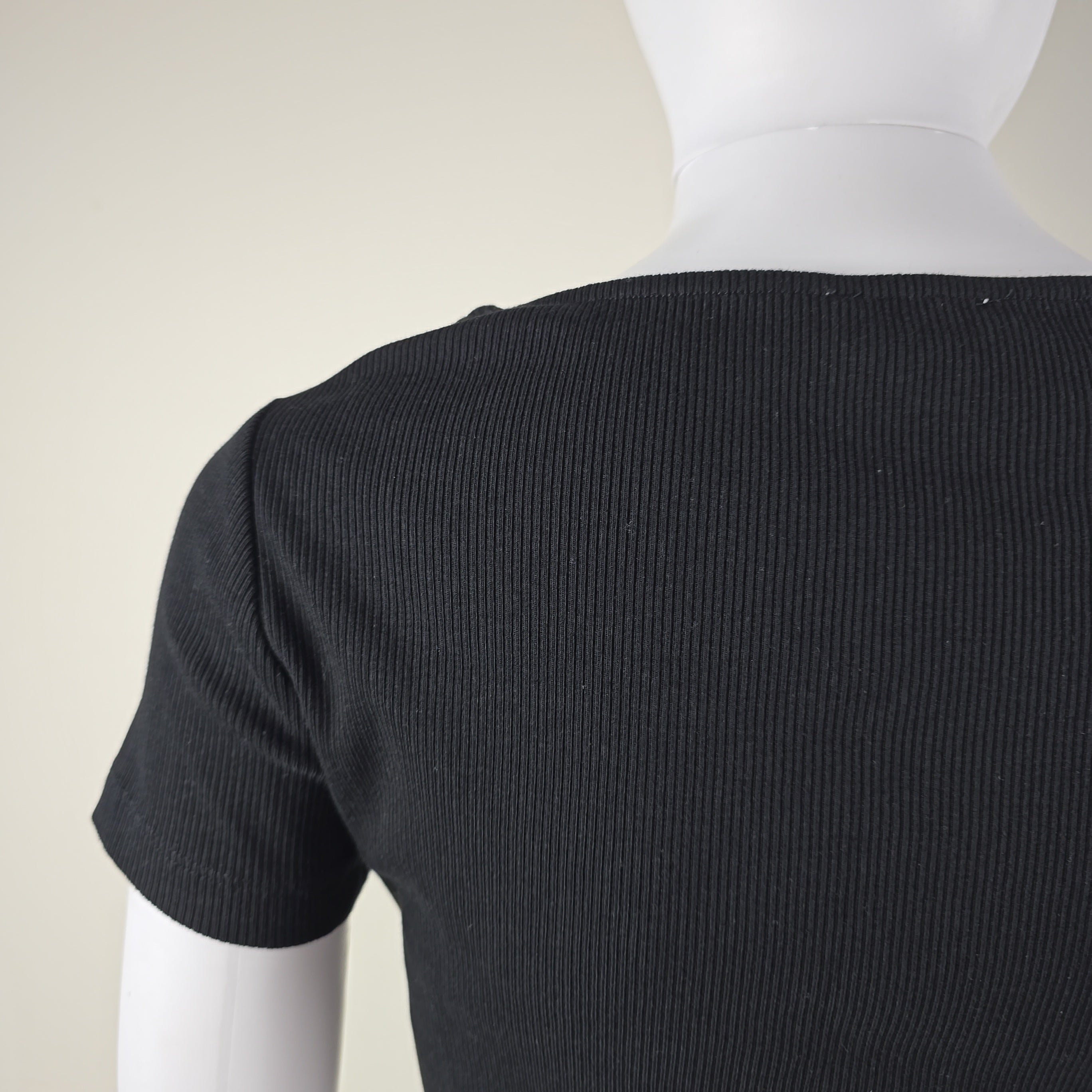 Close-up of a black ribbed fabric on a white background