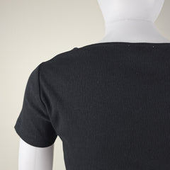 Close-up of a black ribbed fabric on a white background