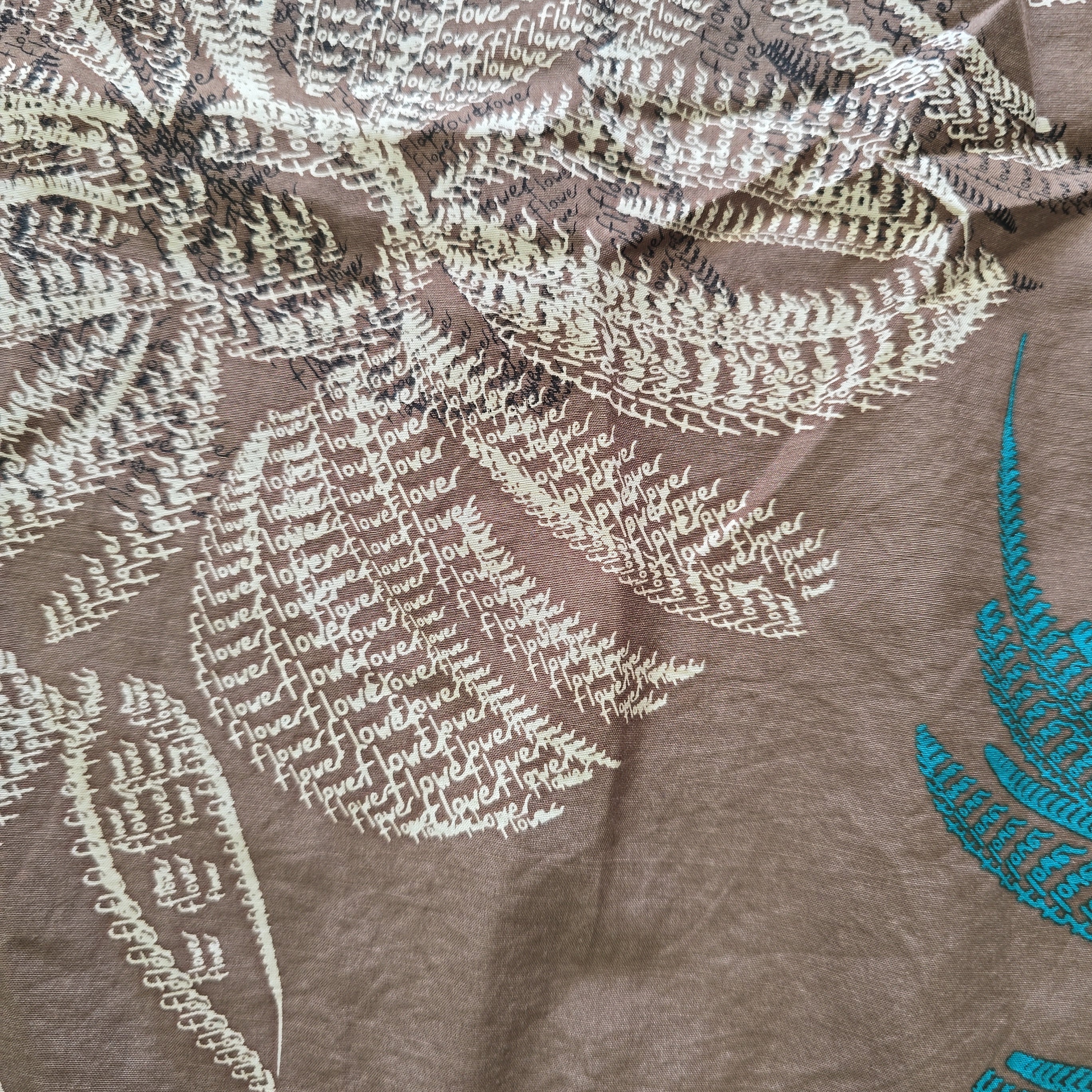 Close-up of leaf patterns on a fabric background