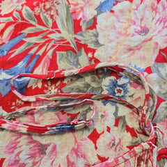 Floral-patterned strap on a floral fabric background