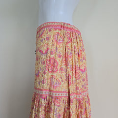 Floral patterned skirt on a mannequin against a plain background