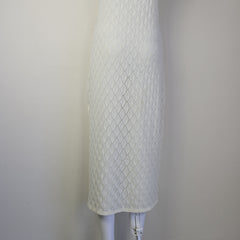 White textured dress on a light background.