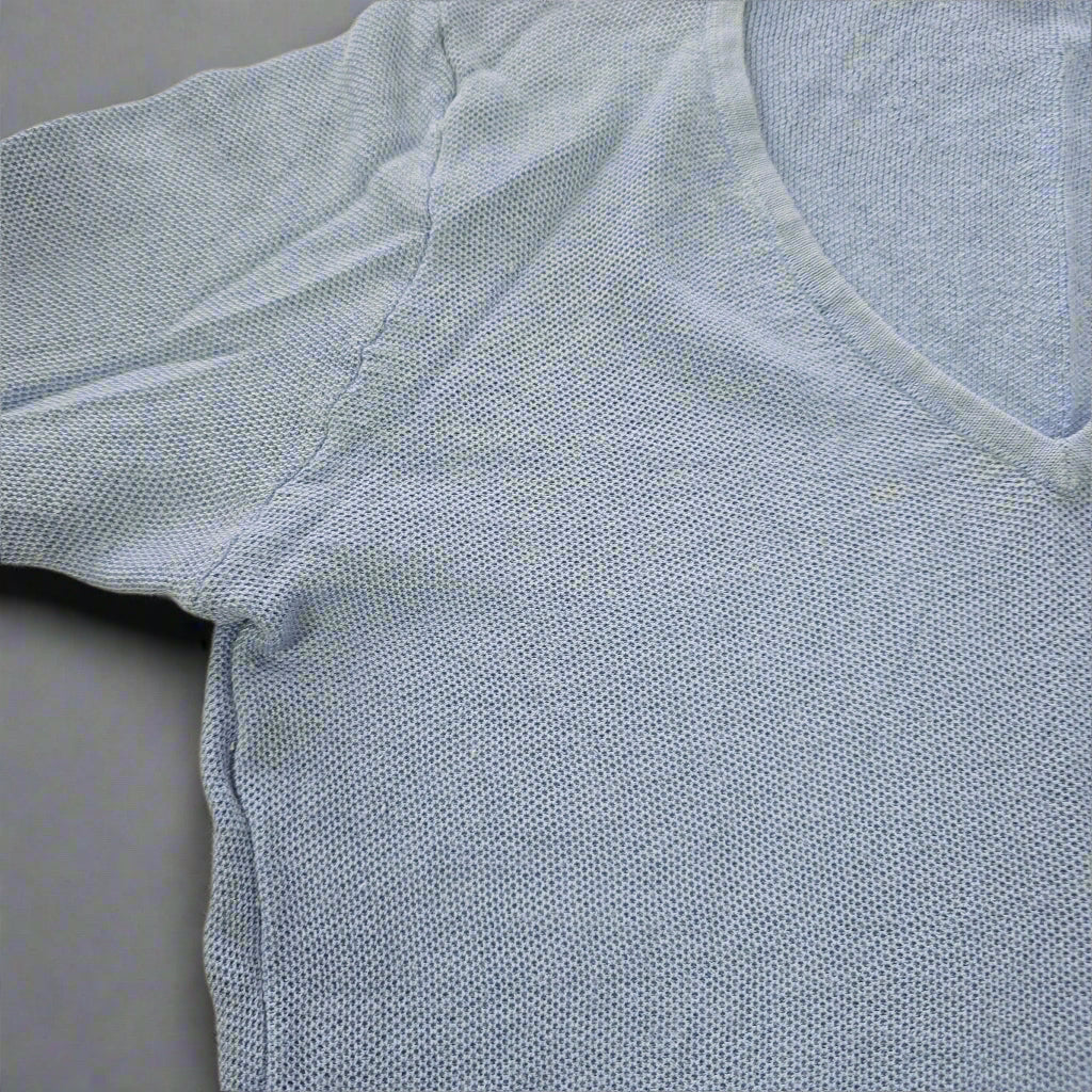 Light blue textured fabric on a beige background