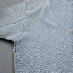 Light blue textured fabric on a beige background