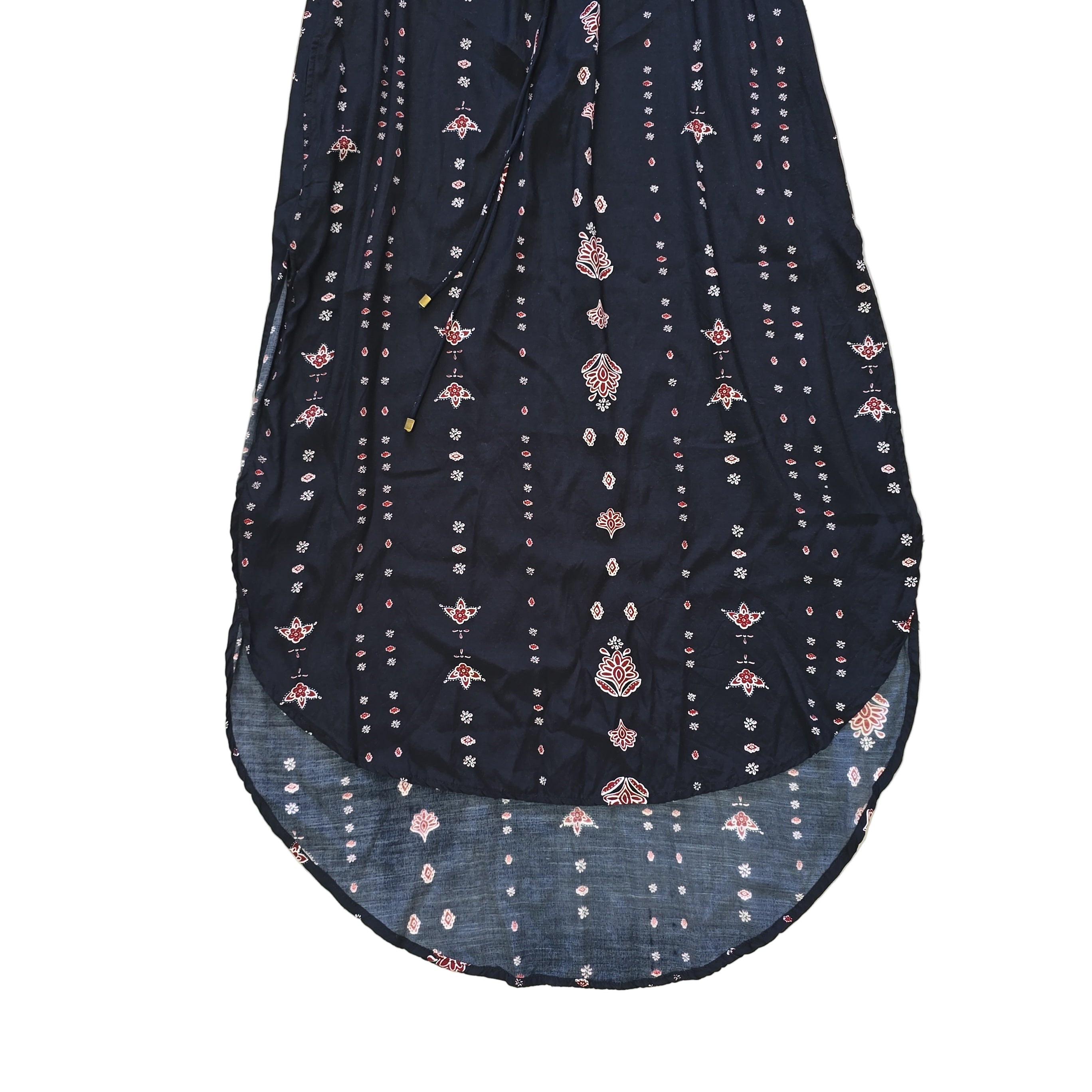 Black dress with white and pink patterns on a light background