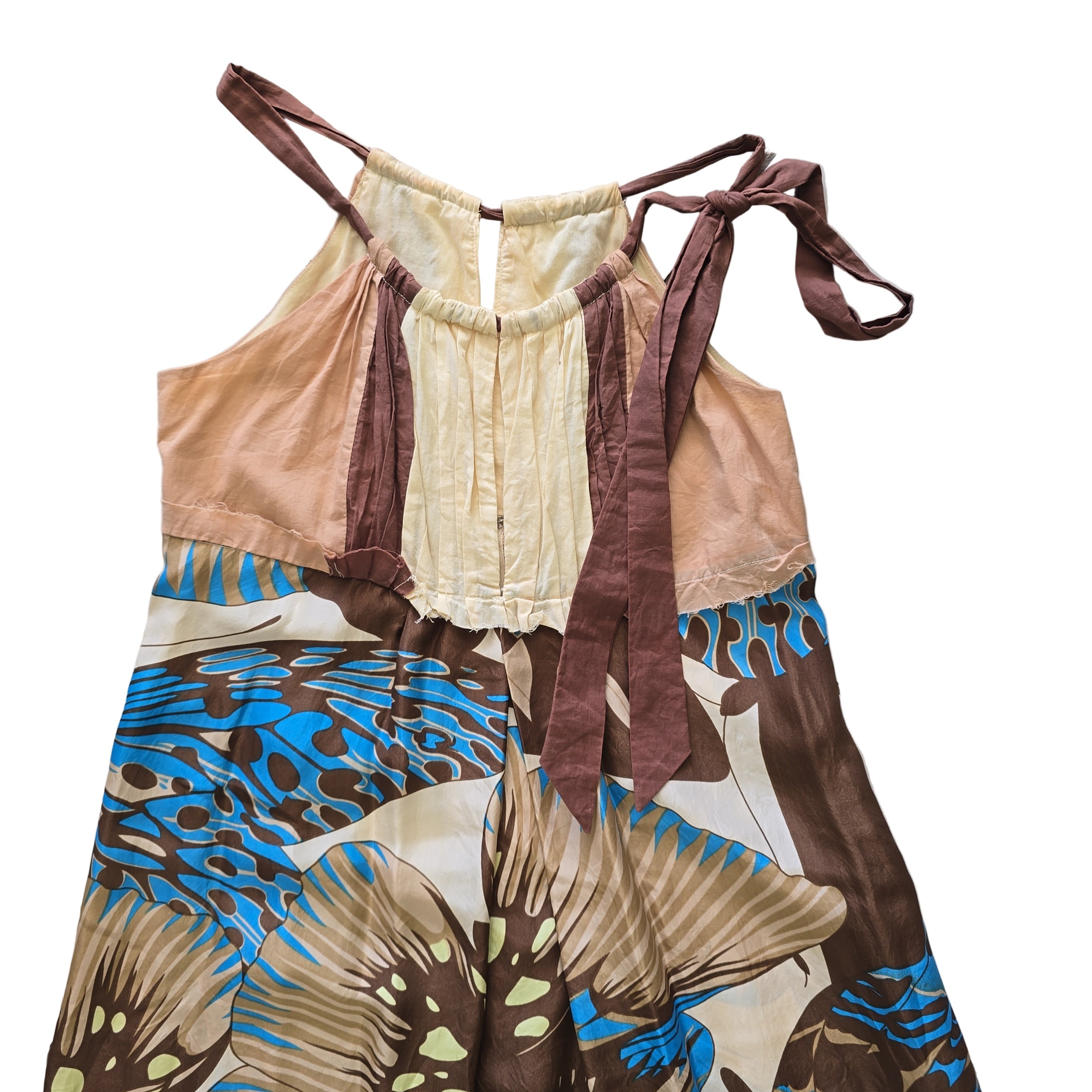 Colorful butterfly-patterned fabric on a tiled floor