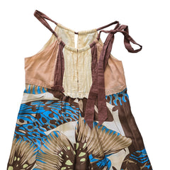 Colorful butterfly-patterned fabric on a tiled floor