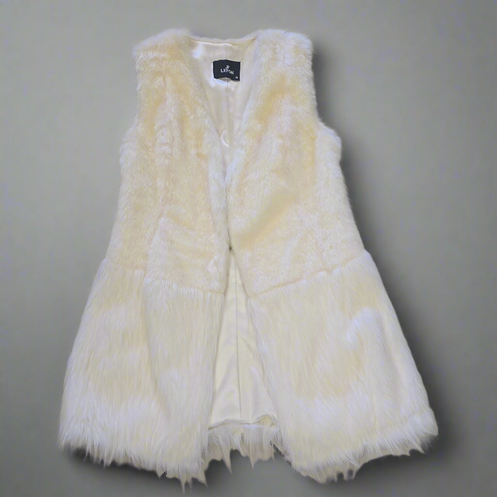 White fur vest on a tiled floor